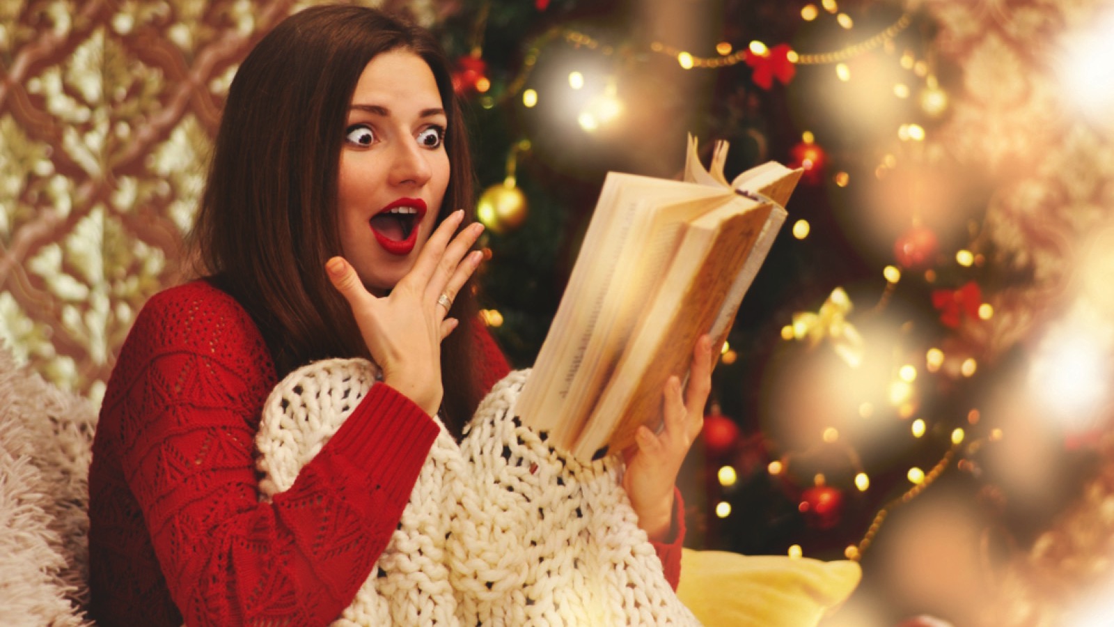 Beautiful woman reading novel and scared