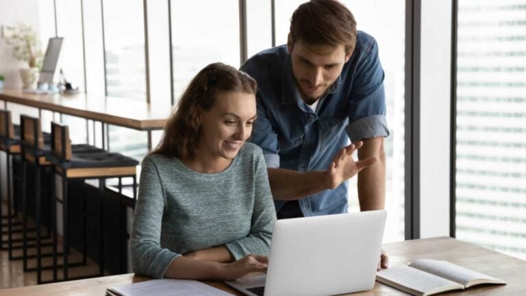 Manager teaching the co worker