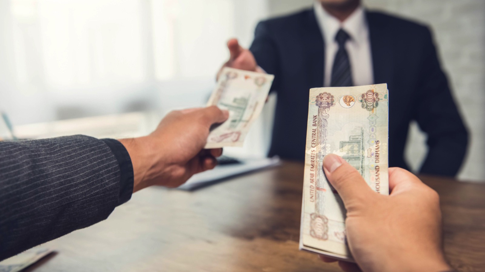 Businessman giving money for services