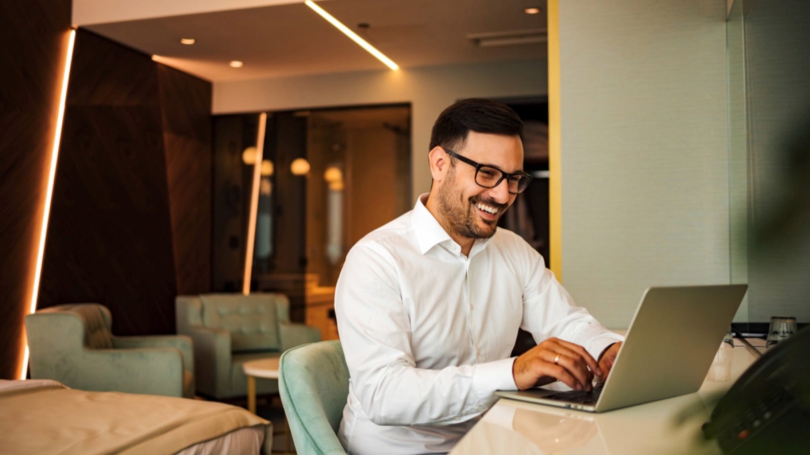 Businessman in hotel working in laptop