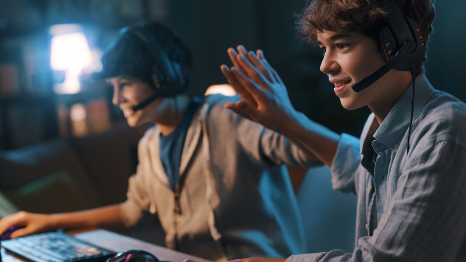 Cheerful friends playing video game
