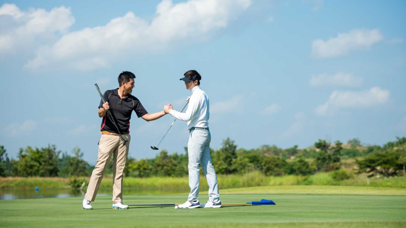 Club members playing golf