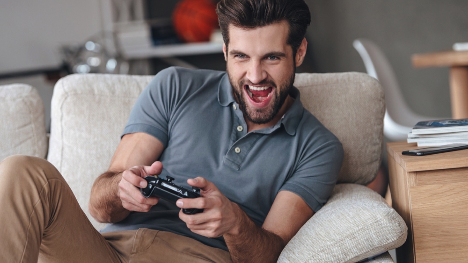 Handsome man playing video game