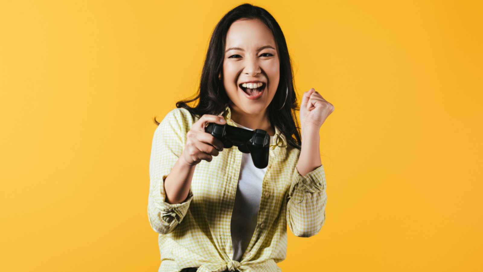 Happy woman playing video game