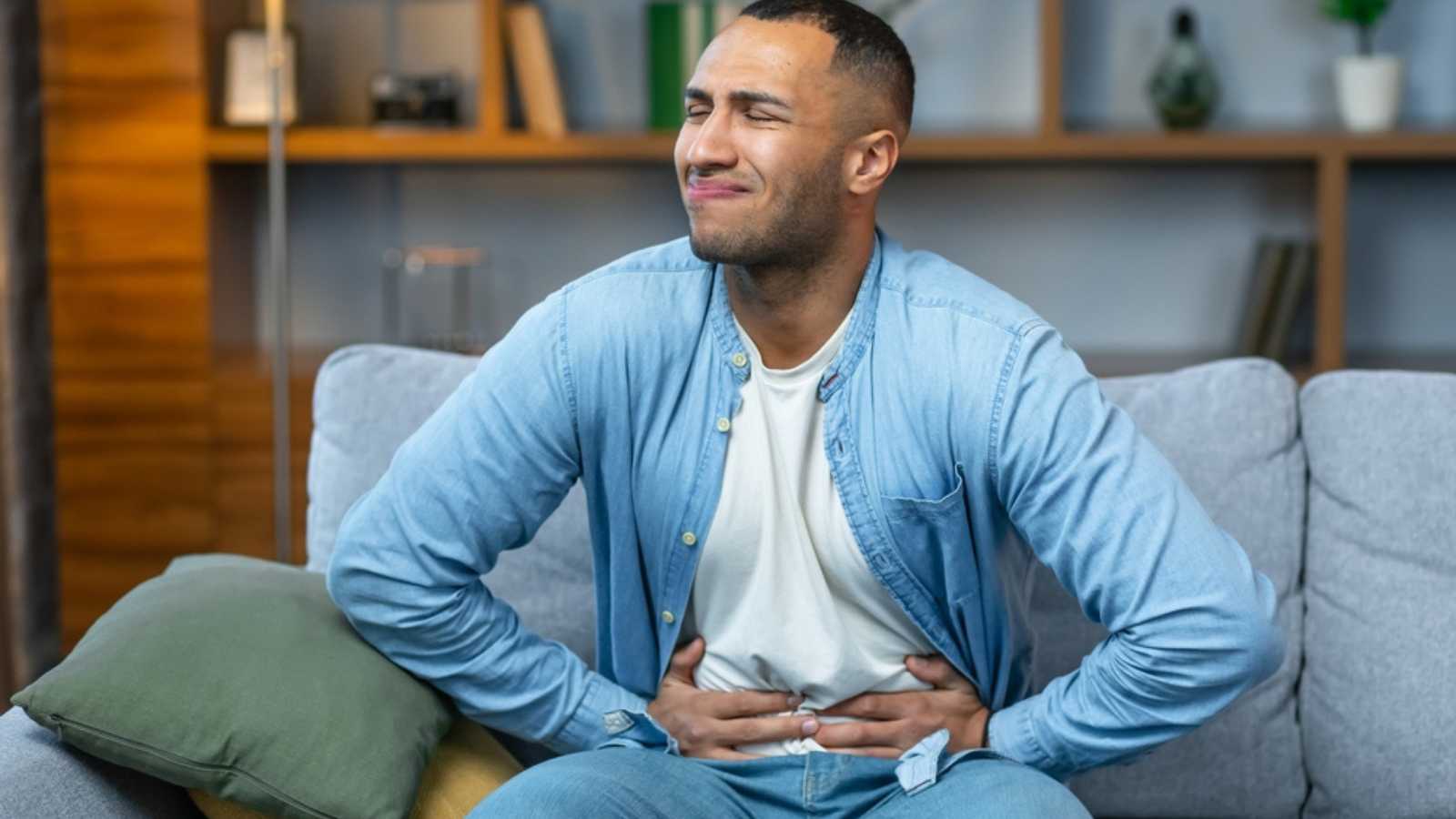 Man having stomach pain after eating too much
