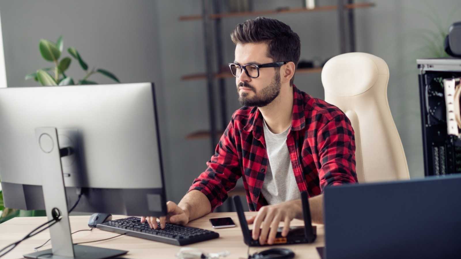 Man working in desktop computer