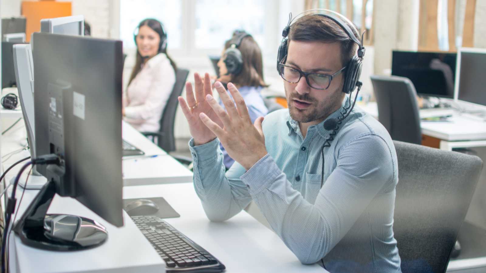 Man working stressed in office