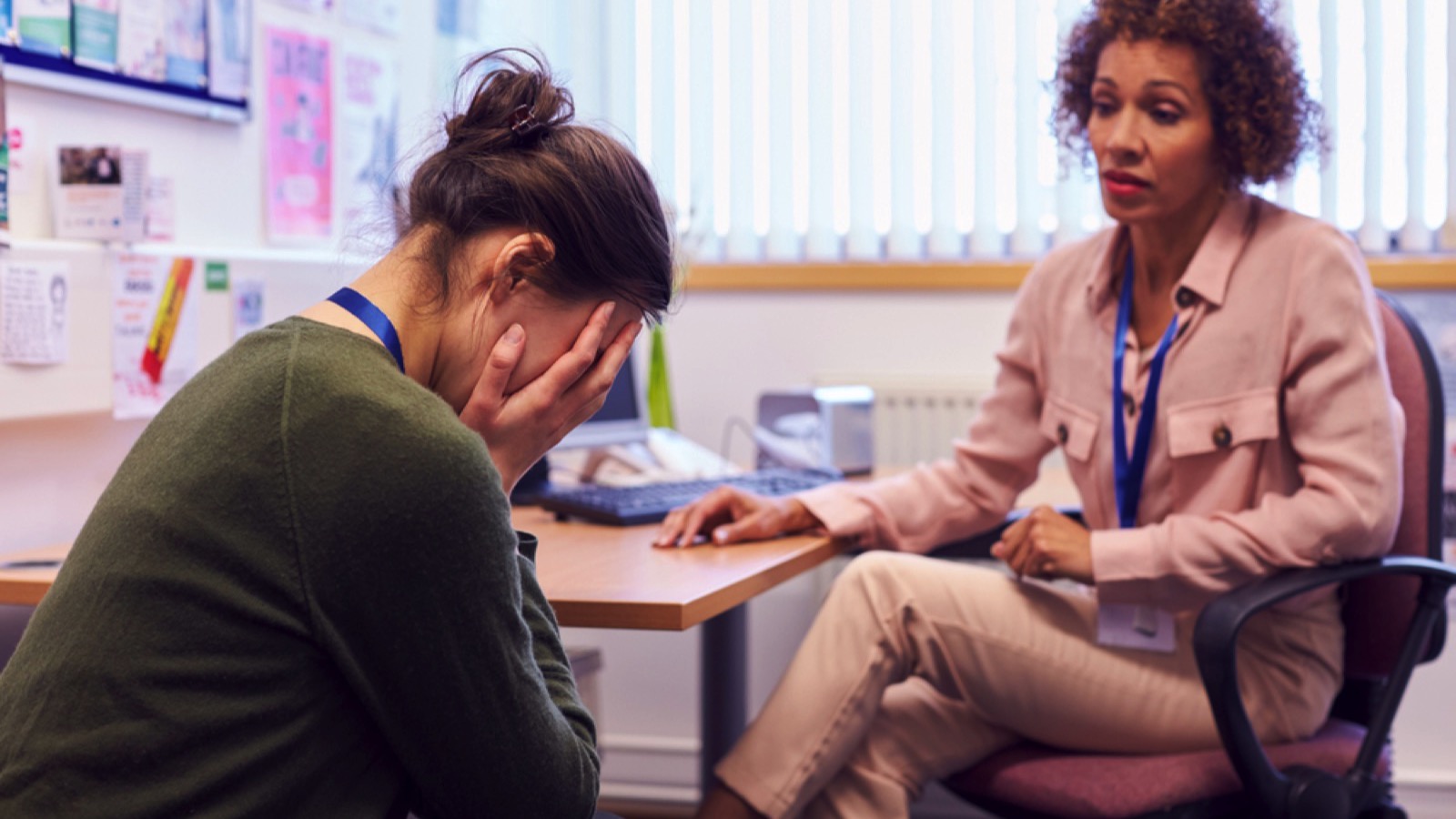 Teacher talking to student