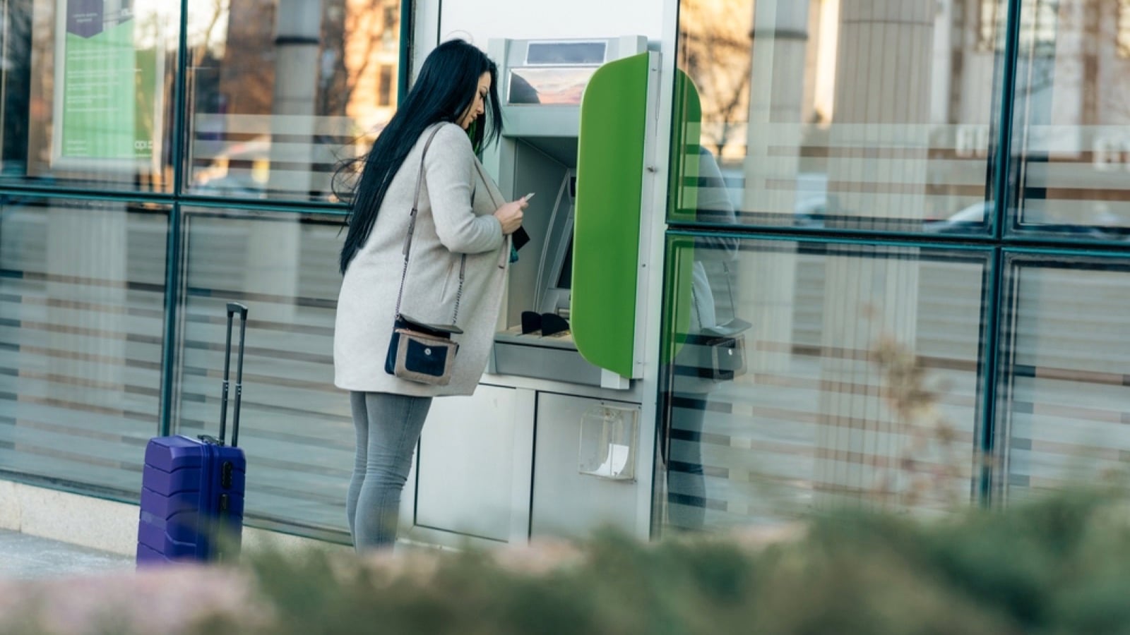 Traveler using ATM