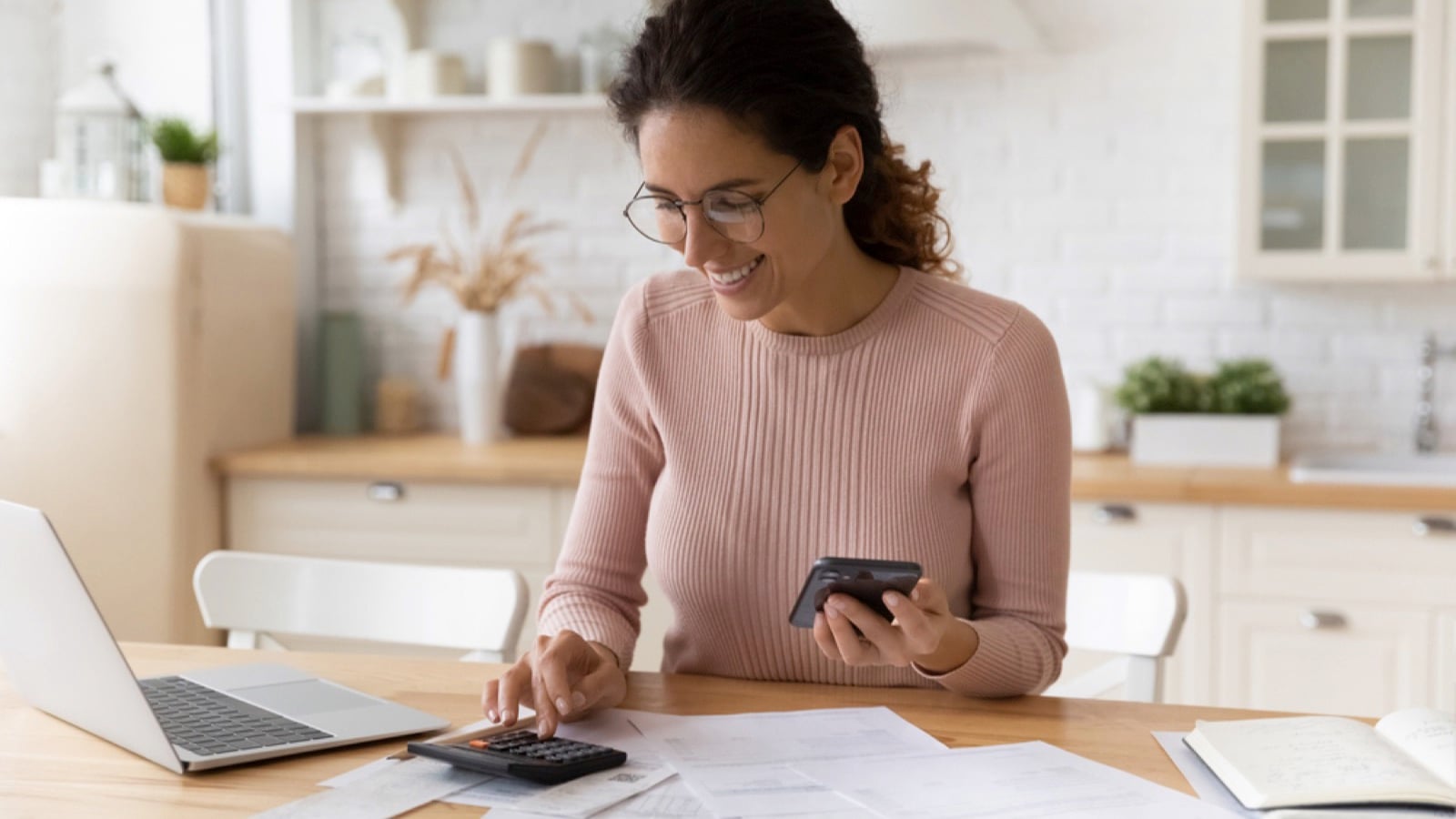 Woman budgeting with mobile