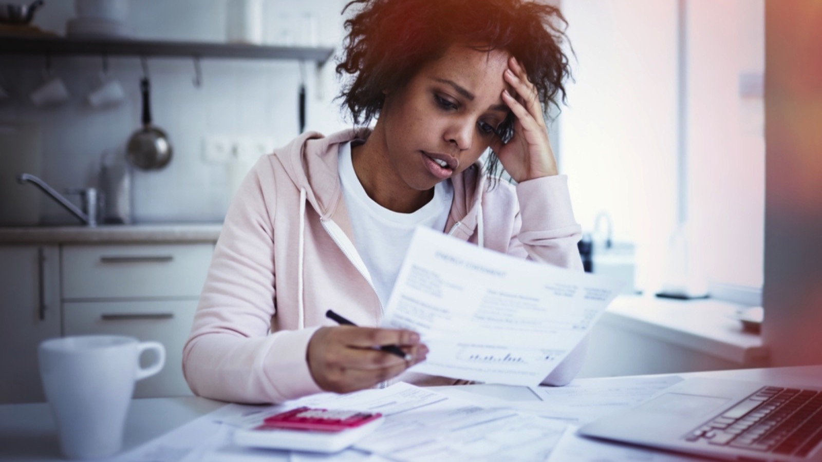 African female seeing bills