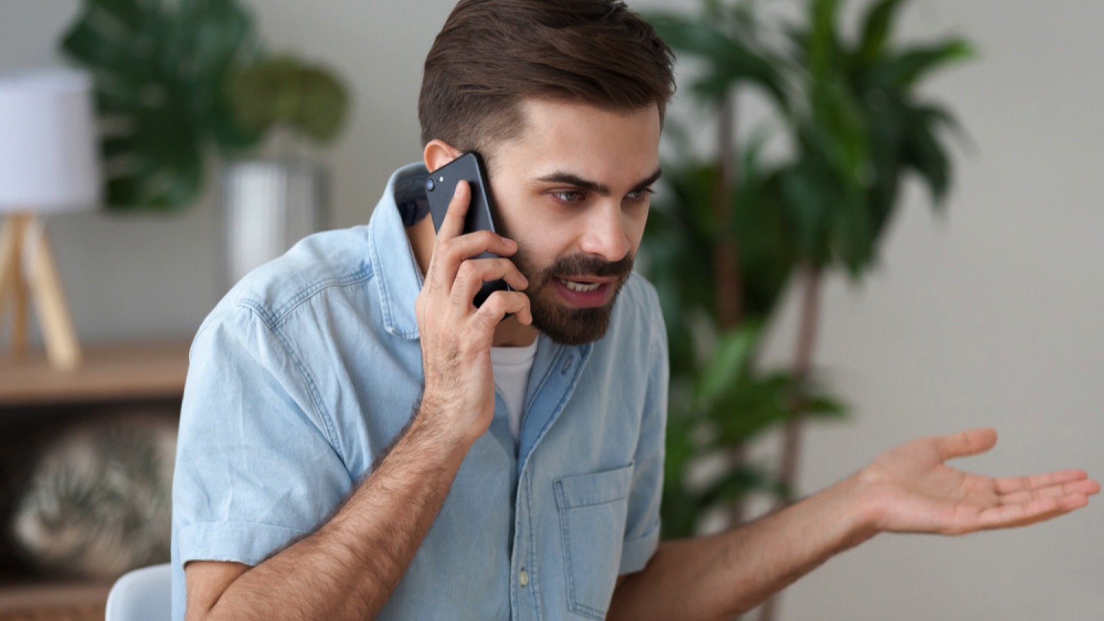 Angry man talking in mobile