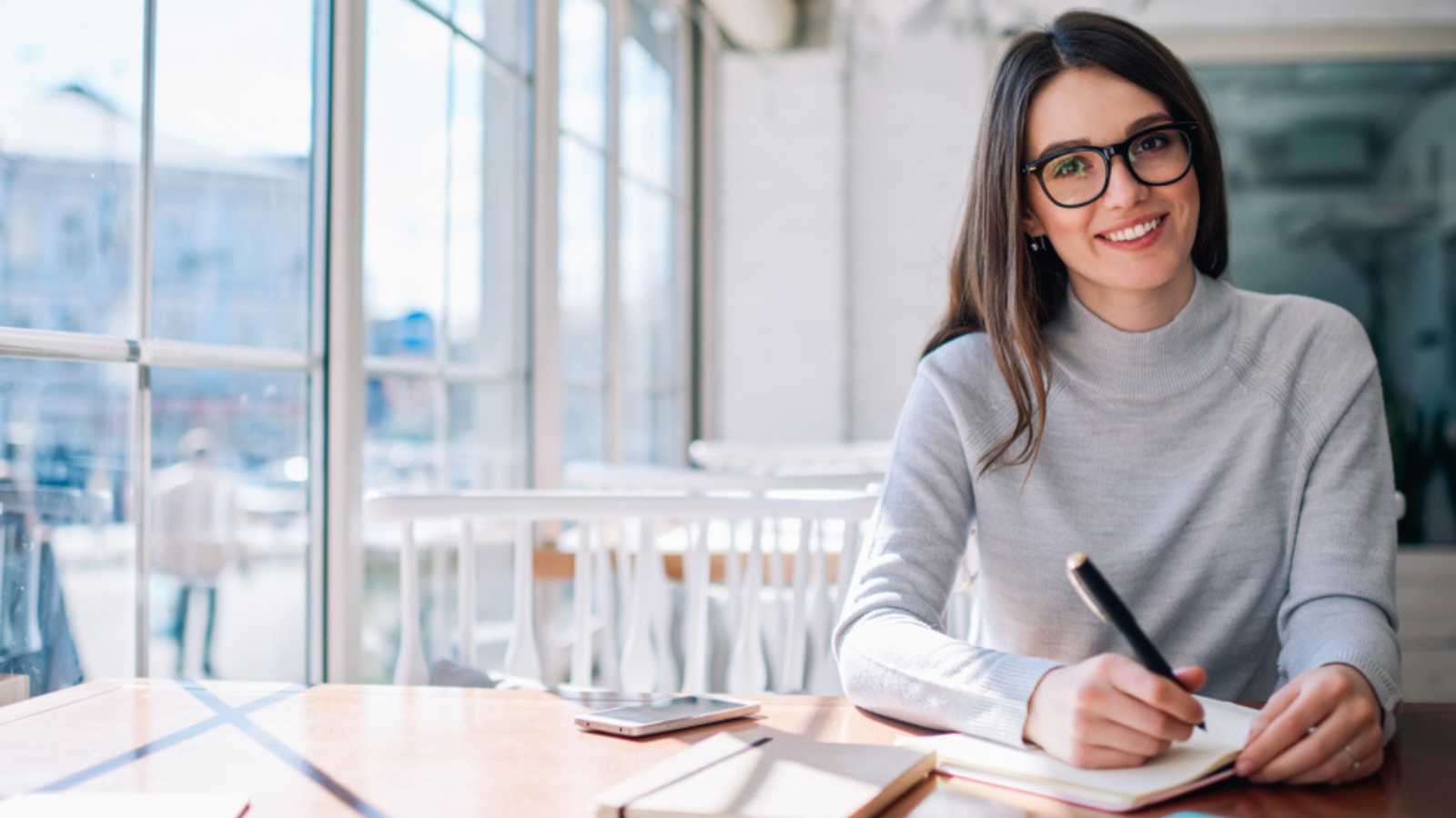 Cheerful girl working as journalist