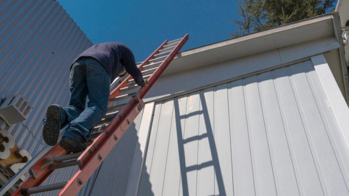 Climbing ladder to fix roof