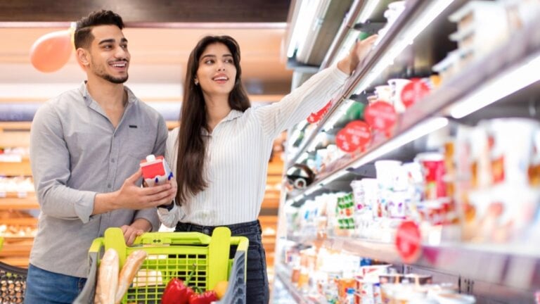 Couples buying in grocery store