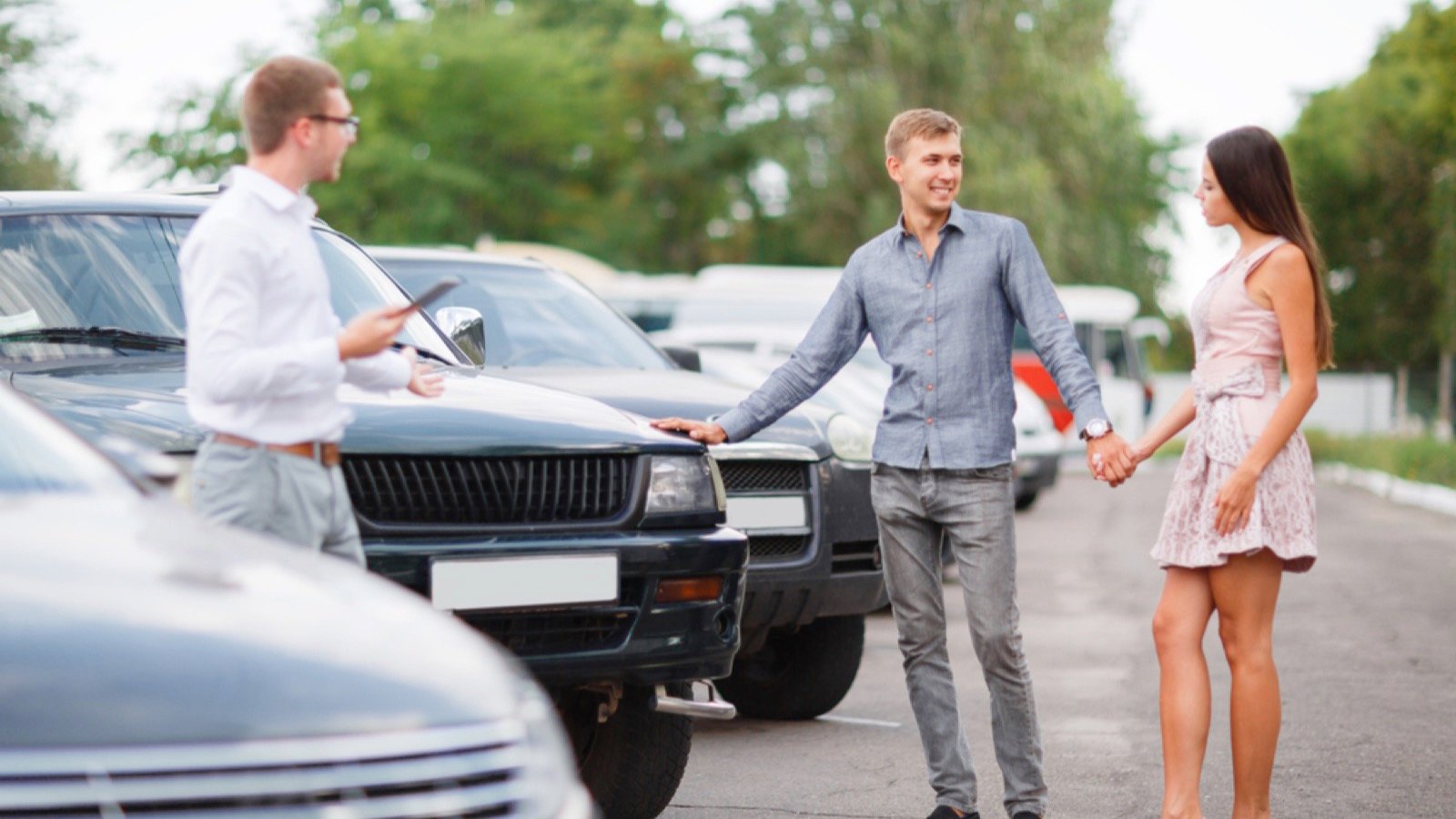 Couples checking on used cars