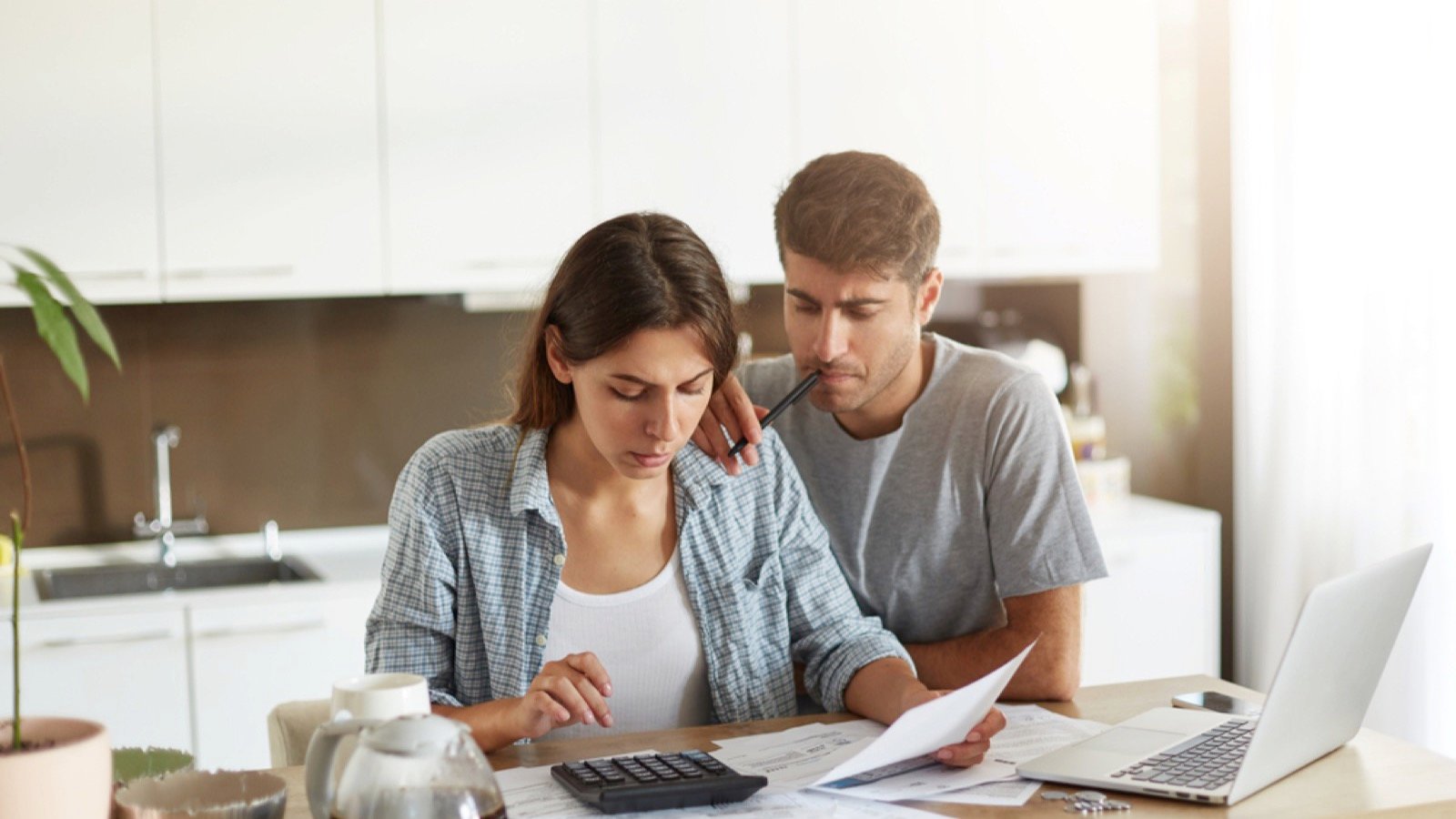 Couples using Mac for budgeting