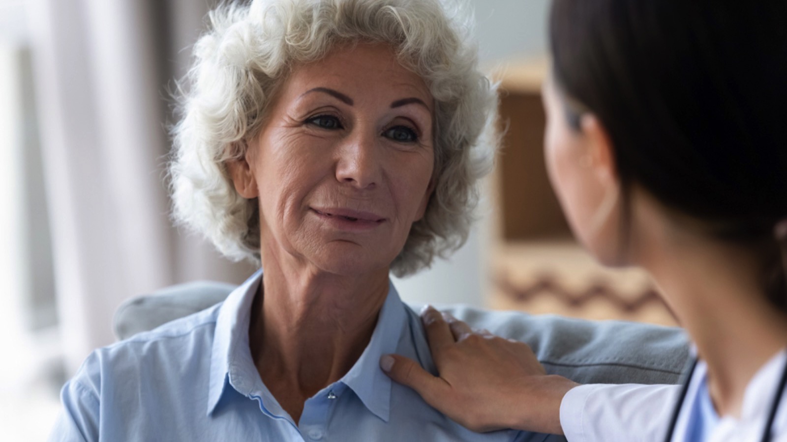 Depressed old woman with therapist