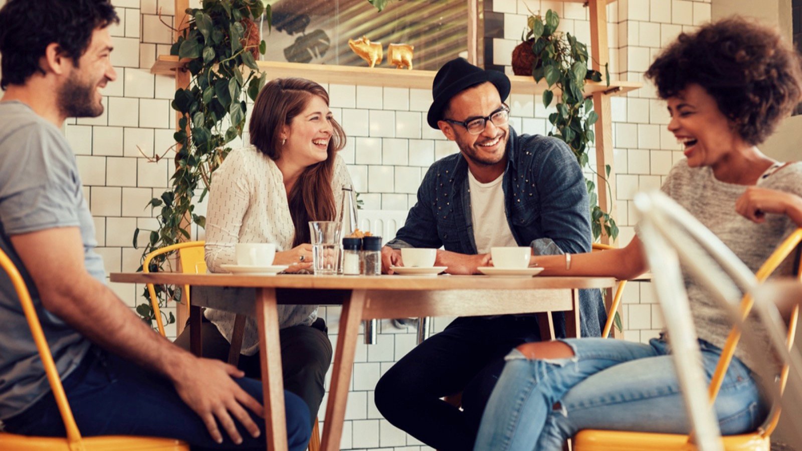 Friends in cafe drinking coffee