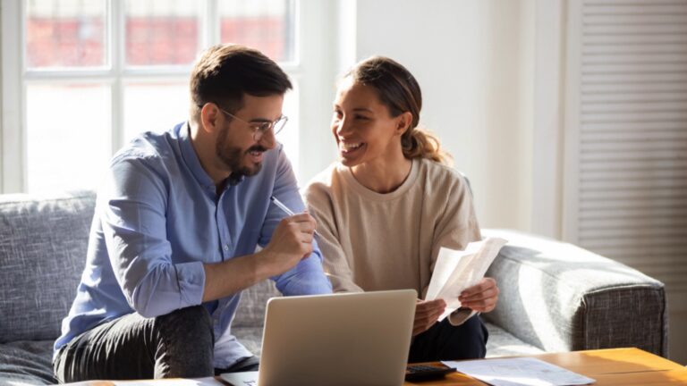 Happy couples discussing about tax