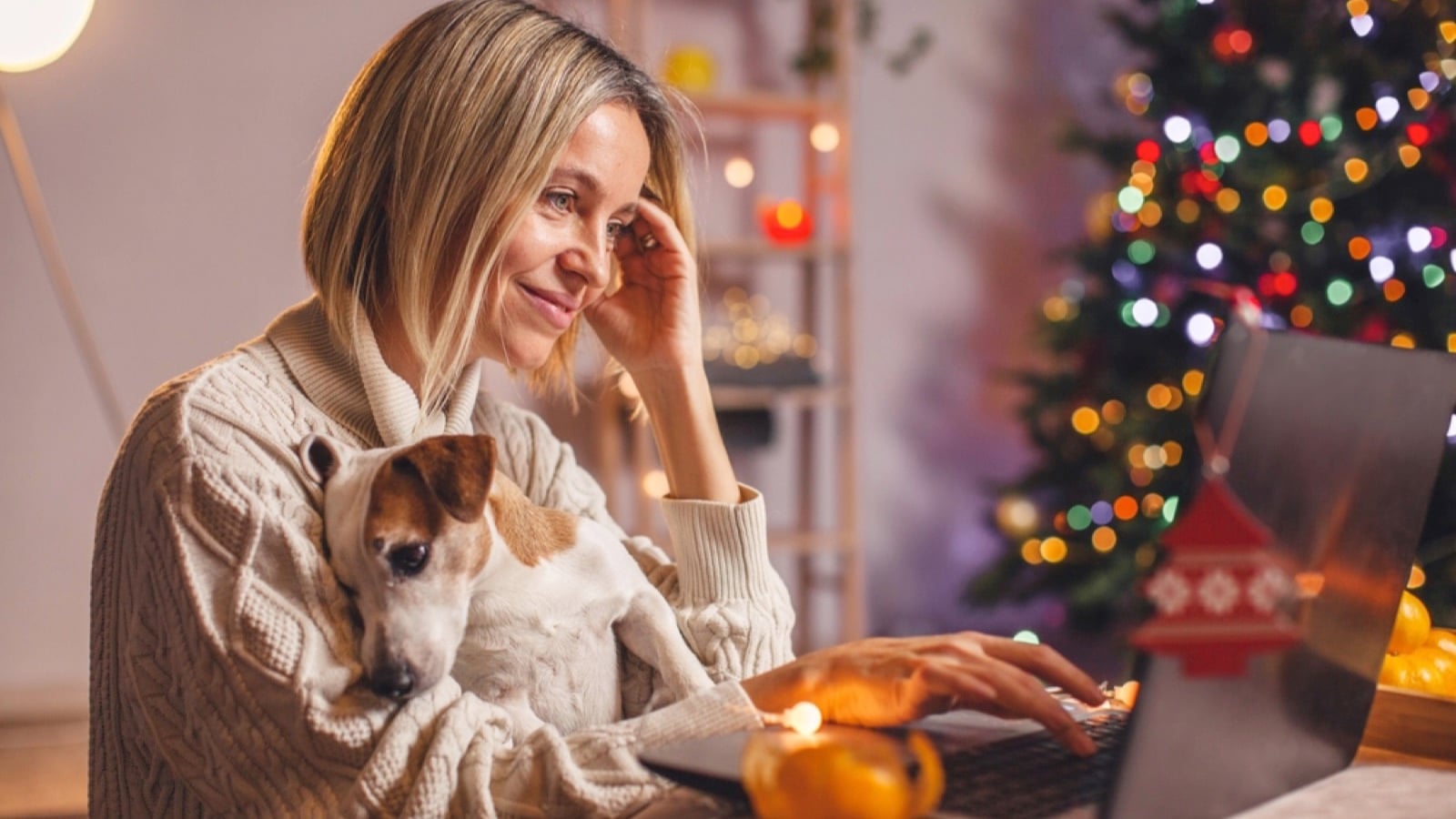 Happy woman using laptop