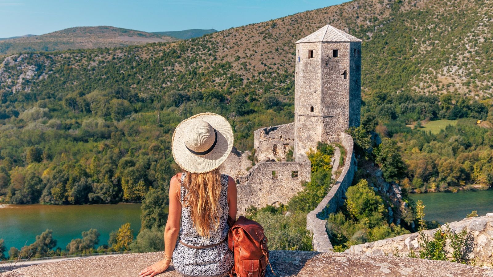 woman sitting in an overlooking view