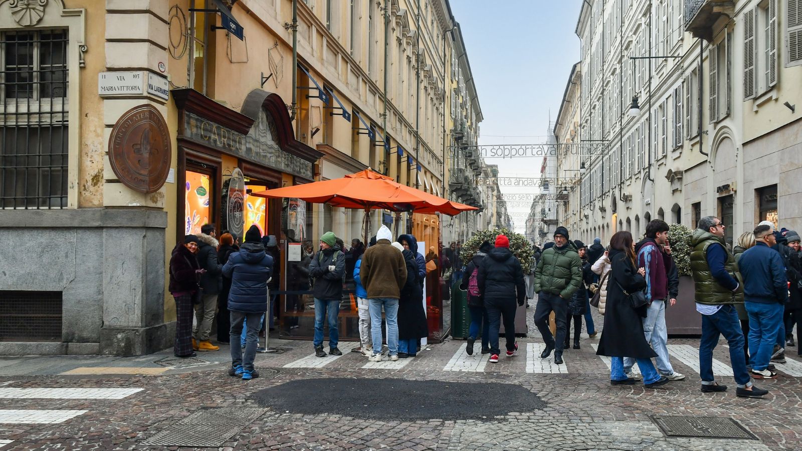 long line of people waiting to enter tourist spot