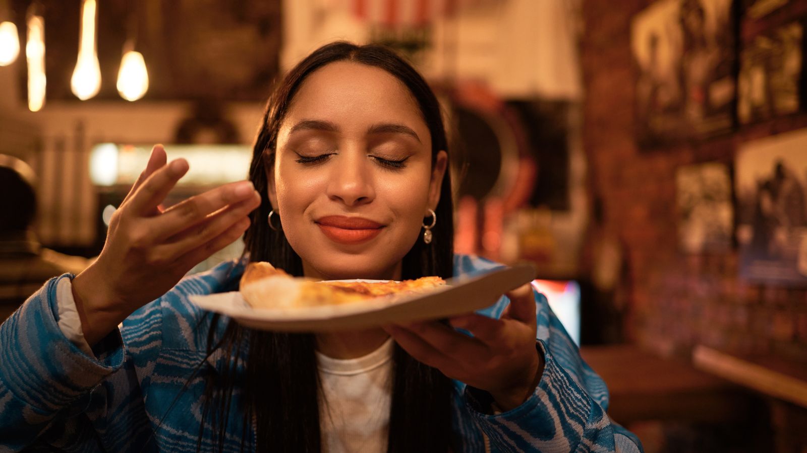 woman smelling her food