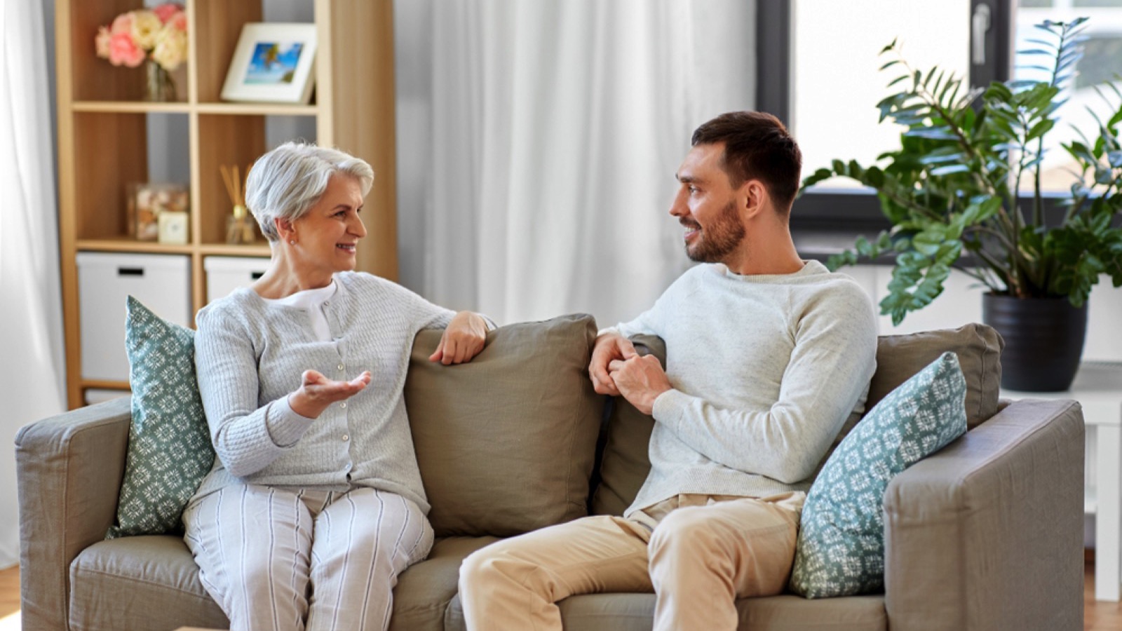 Man discussing with mother about bills