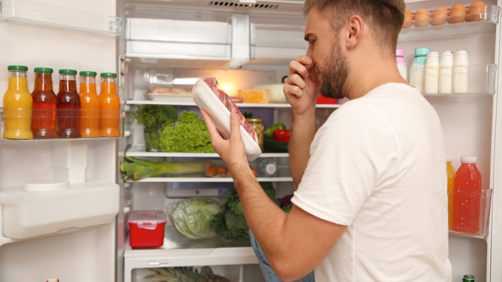 Man having rotten meat in hand