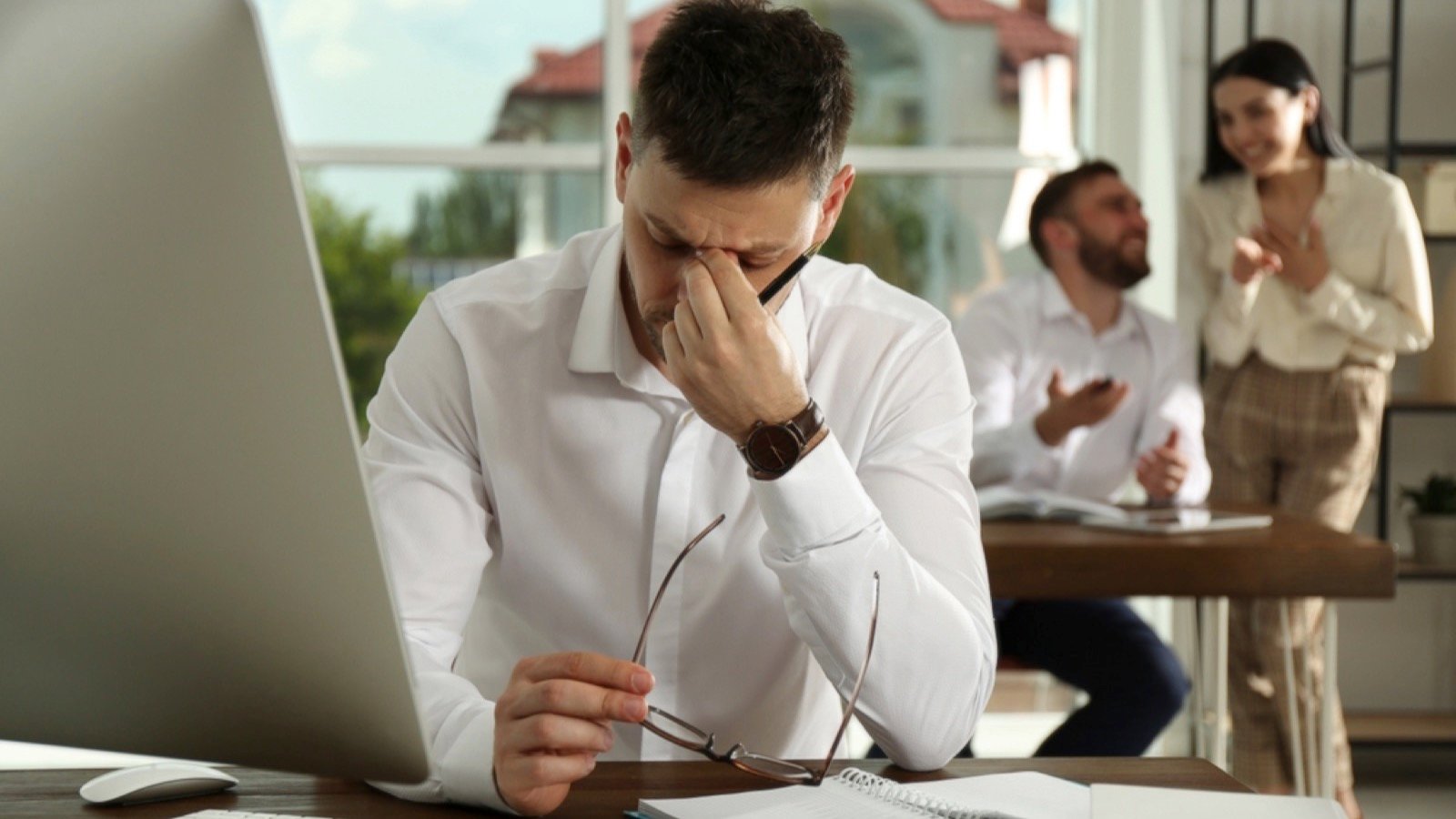 Man suffering from toxic environment at work