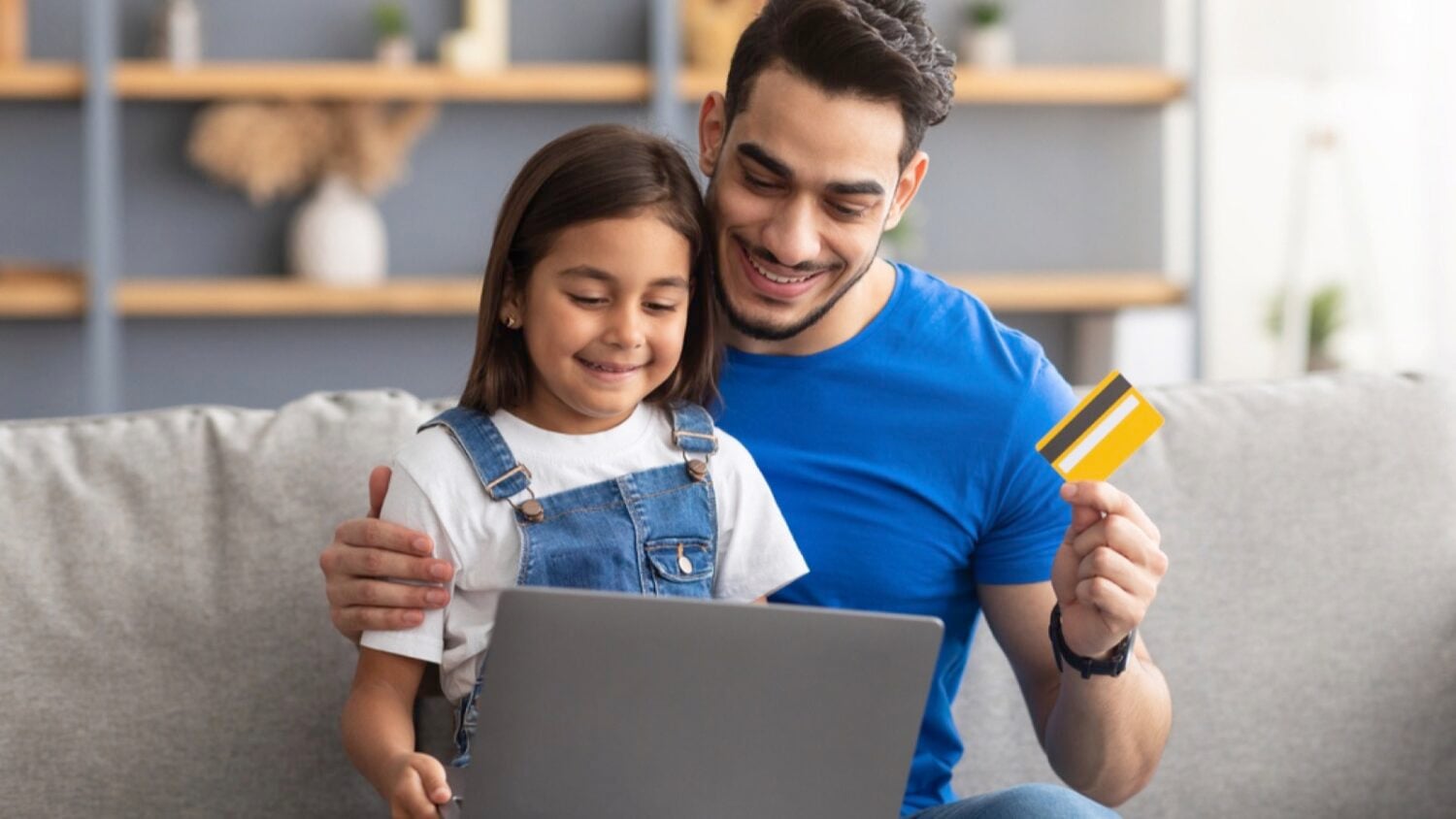 Man with kid and credit card
