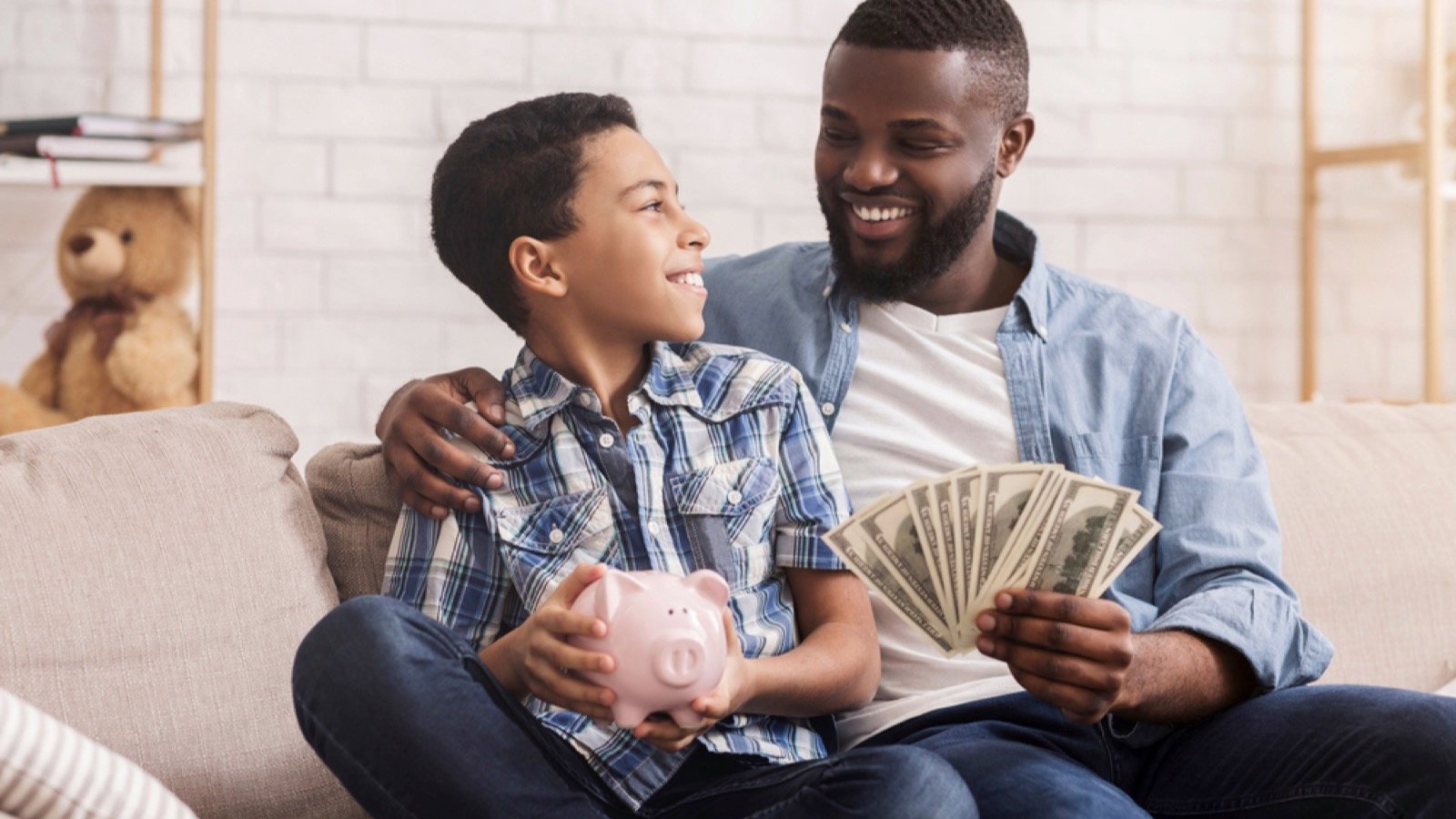 Man with son saving money