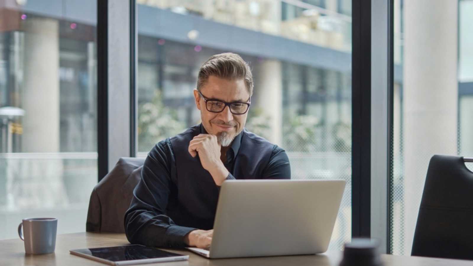 Middle aged man working with laptop