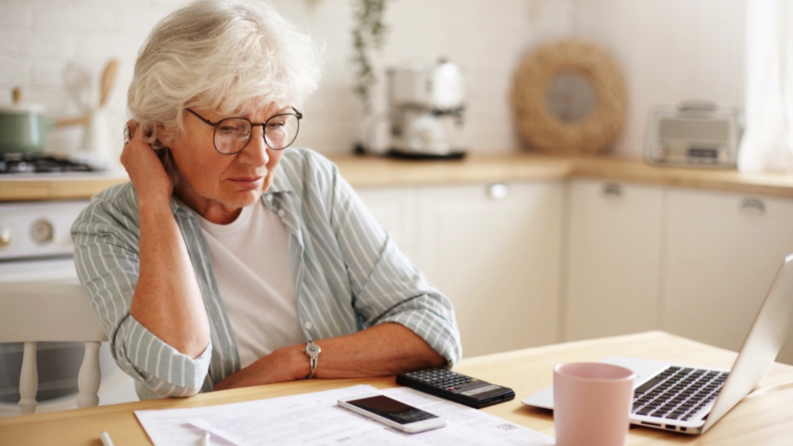 Old woman seeing bills
