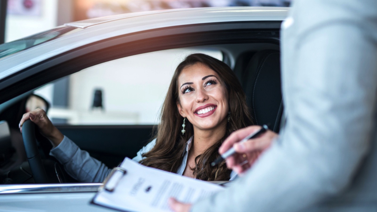 Salesman explaining warranty of leased car