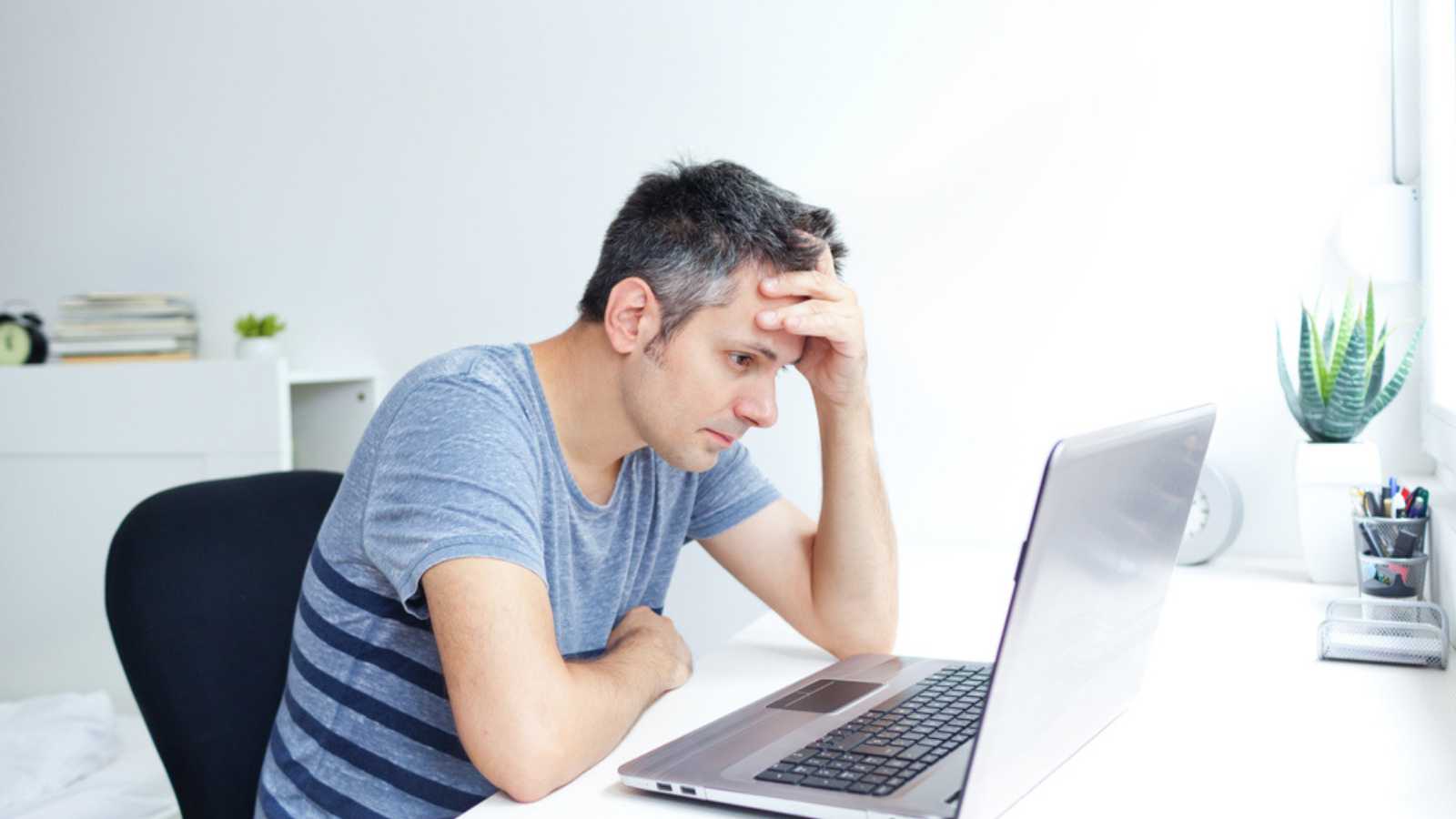Stressed Man with laptop