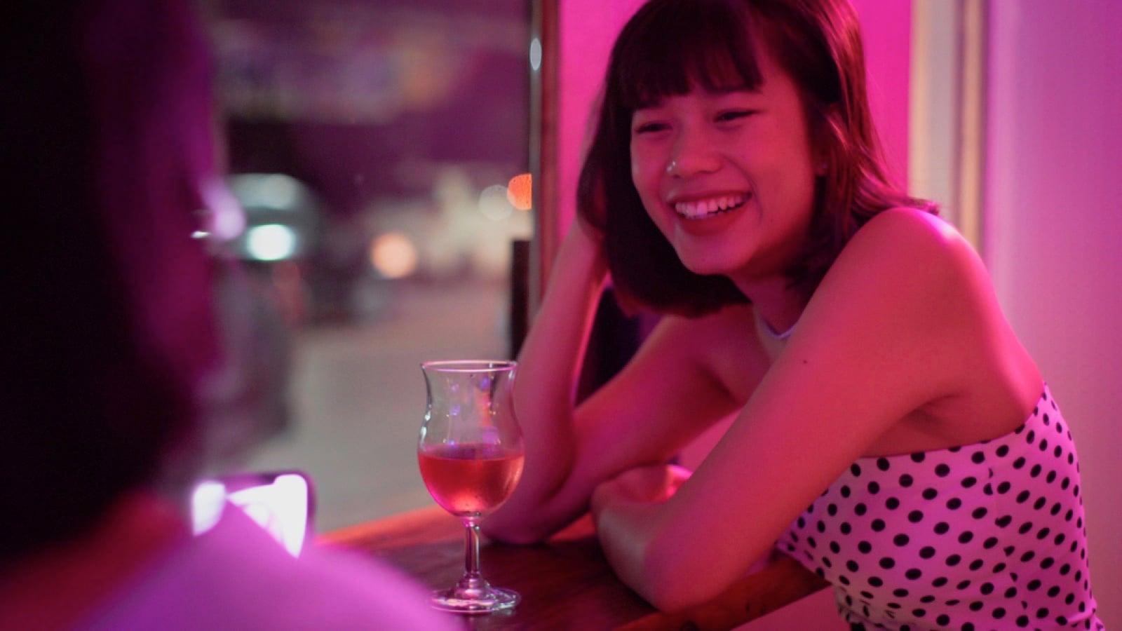 Teen traveler talking to another solo woman