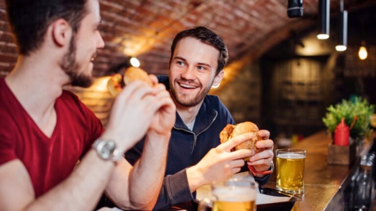 Two men eating in restaurant