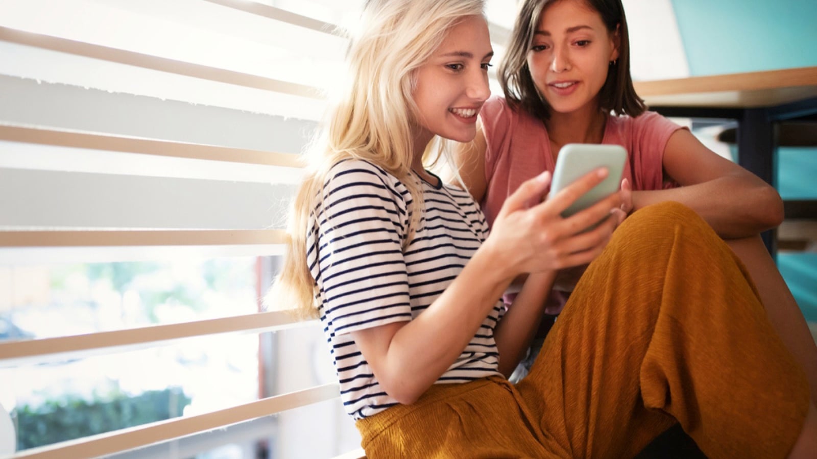 Two woman with mobile