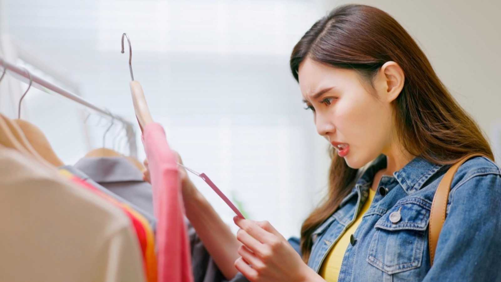 Woman checking price and shocked
