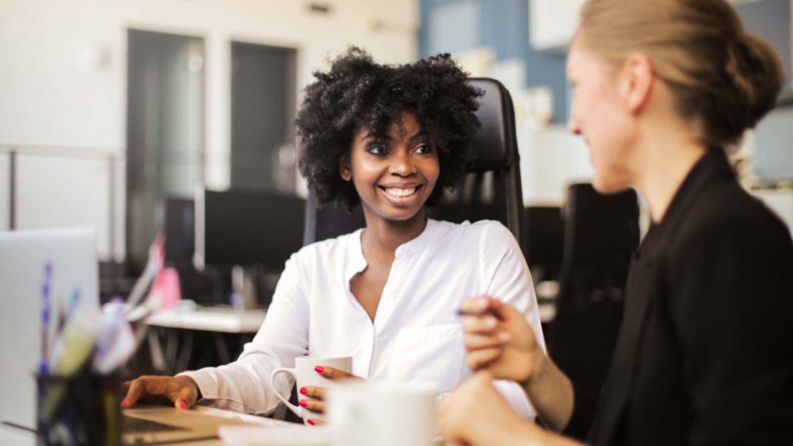 Woman discussing with co worker