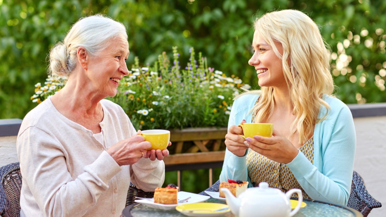 Woman eating with mother in restaurant