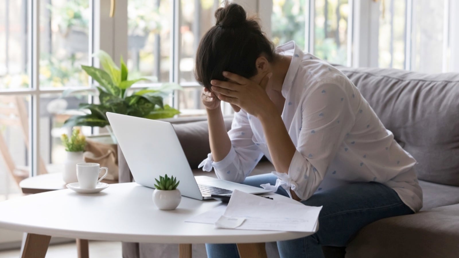 Woman feeling stressed at home