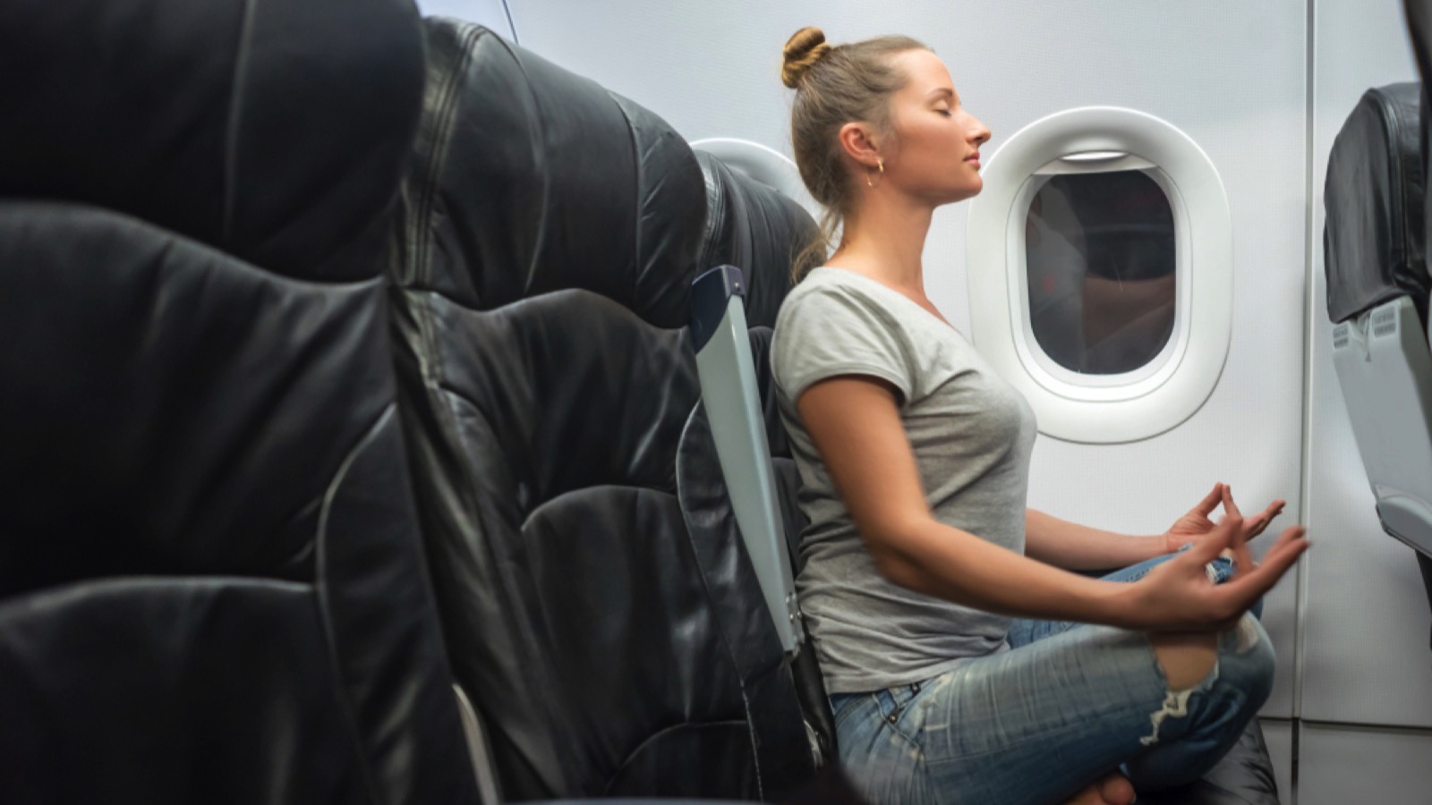 Woman meditating in flight
