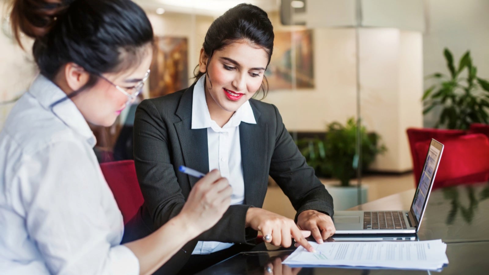 Woman signing papers