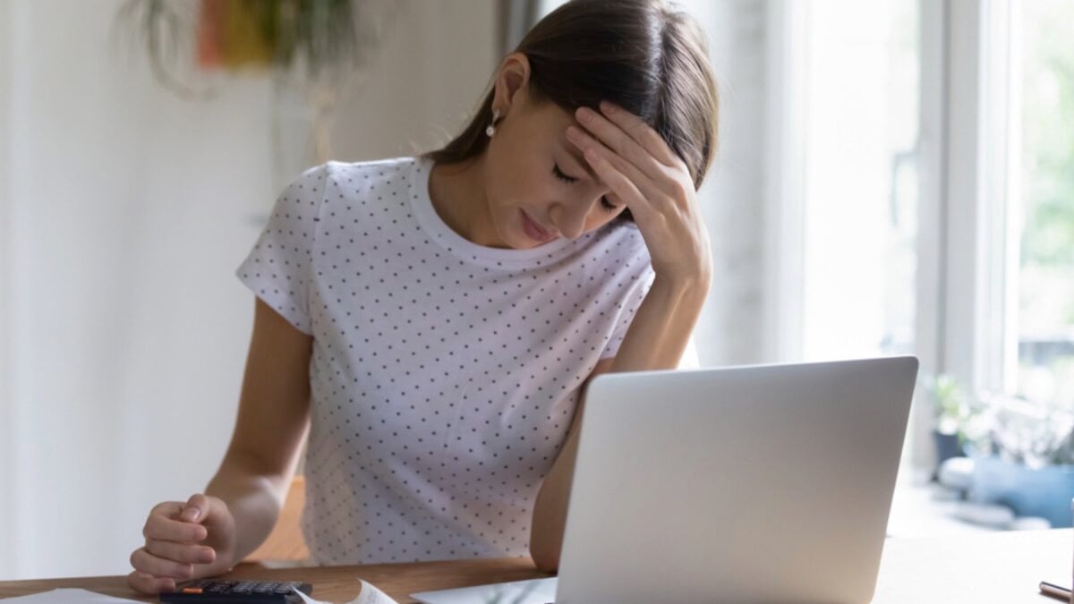 Woman working in laptop stressed