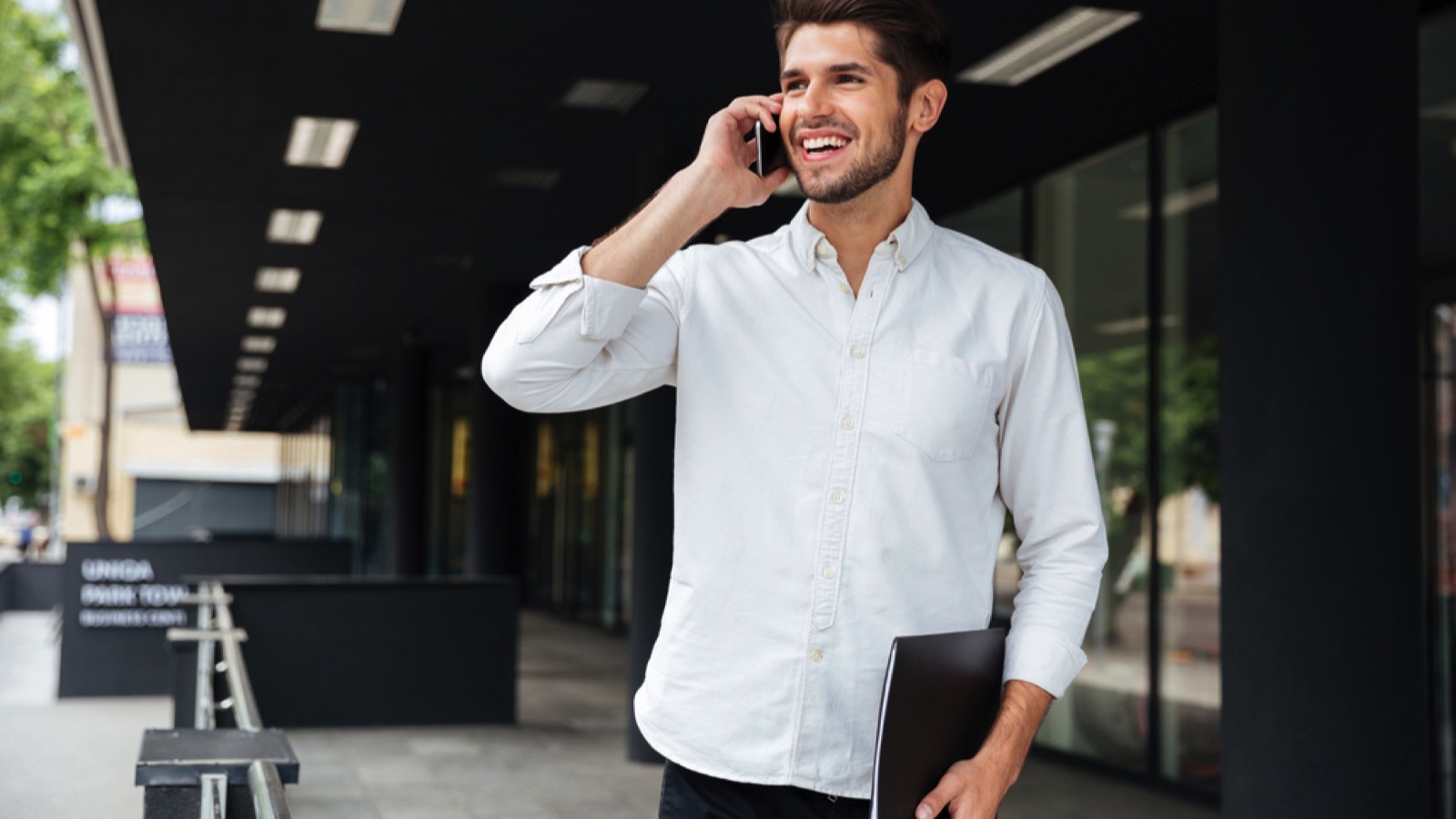 Young handsome man talking in mobile