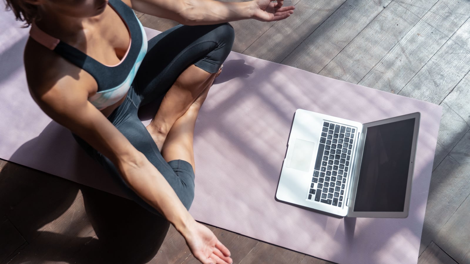 learning yoga at home with laptop
