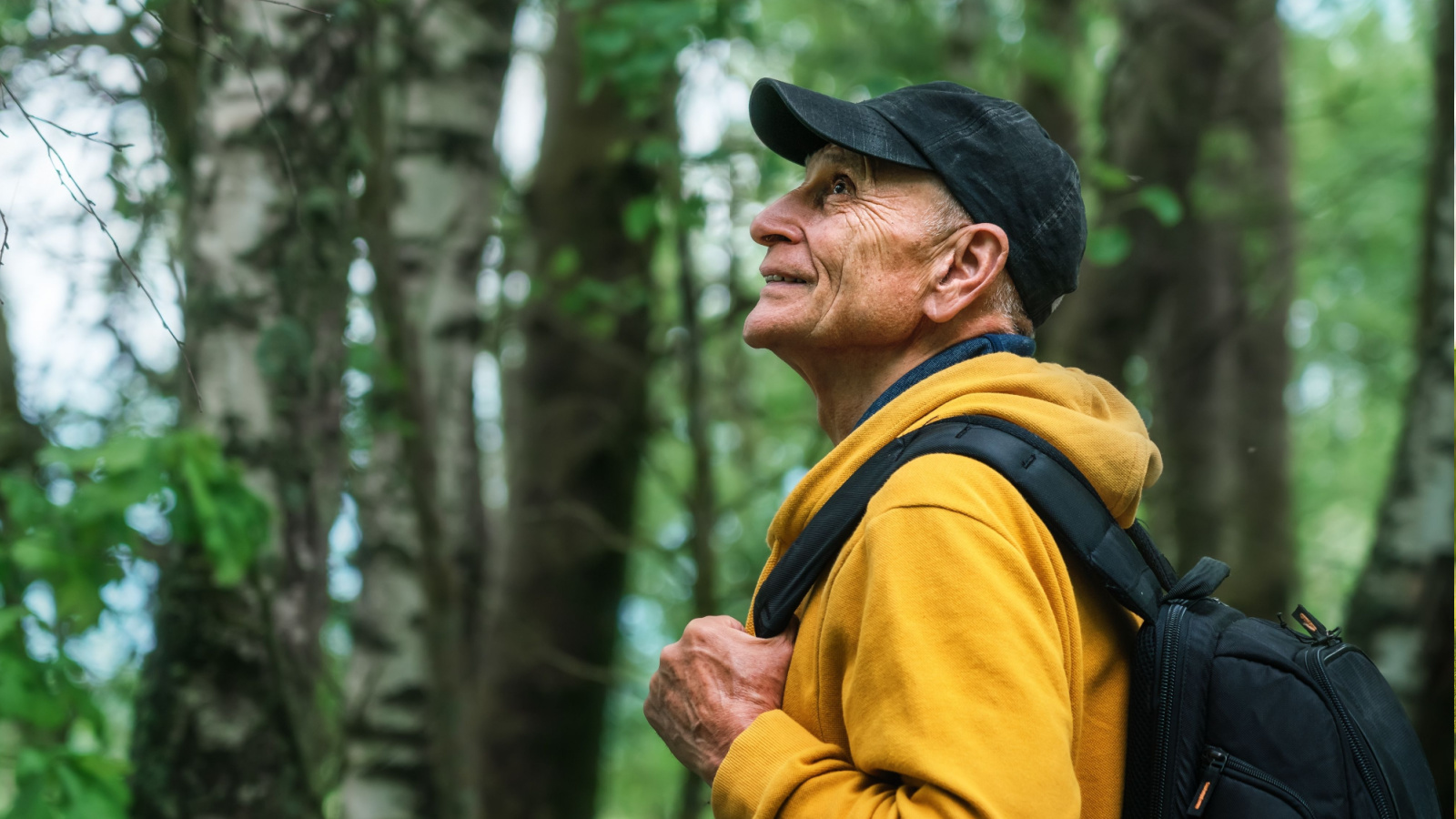 retired person walking in woods
